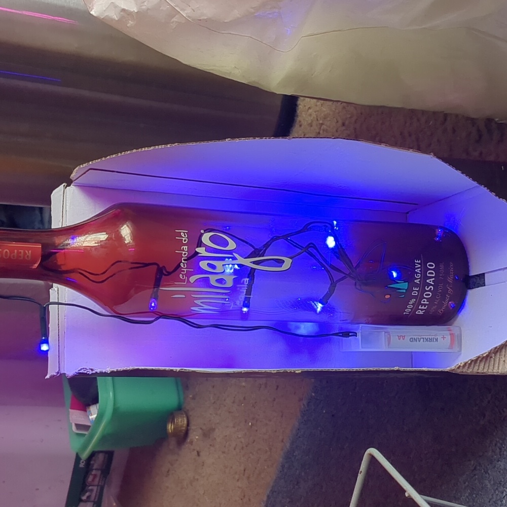 Leyenda del milagro tequila bottle light